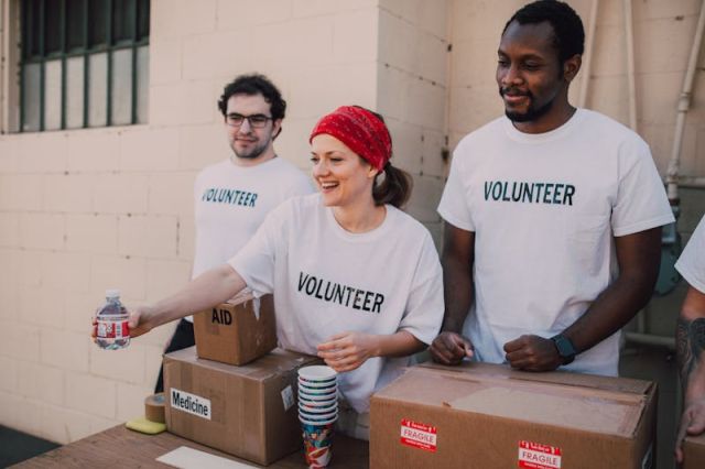 Charity volunteer running a local community wristband fundraiser