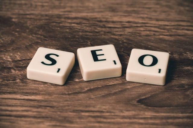 Small business owner doing SEO work on laptop