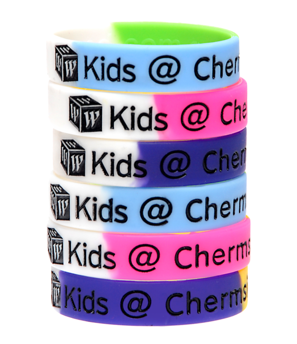 Stack of custom debossed branded silicone wristbands in multiple Pantone-matched colours
