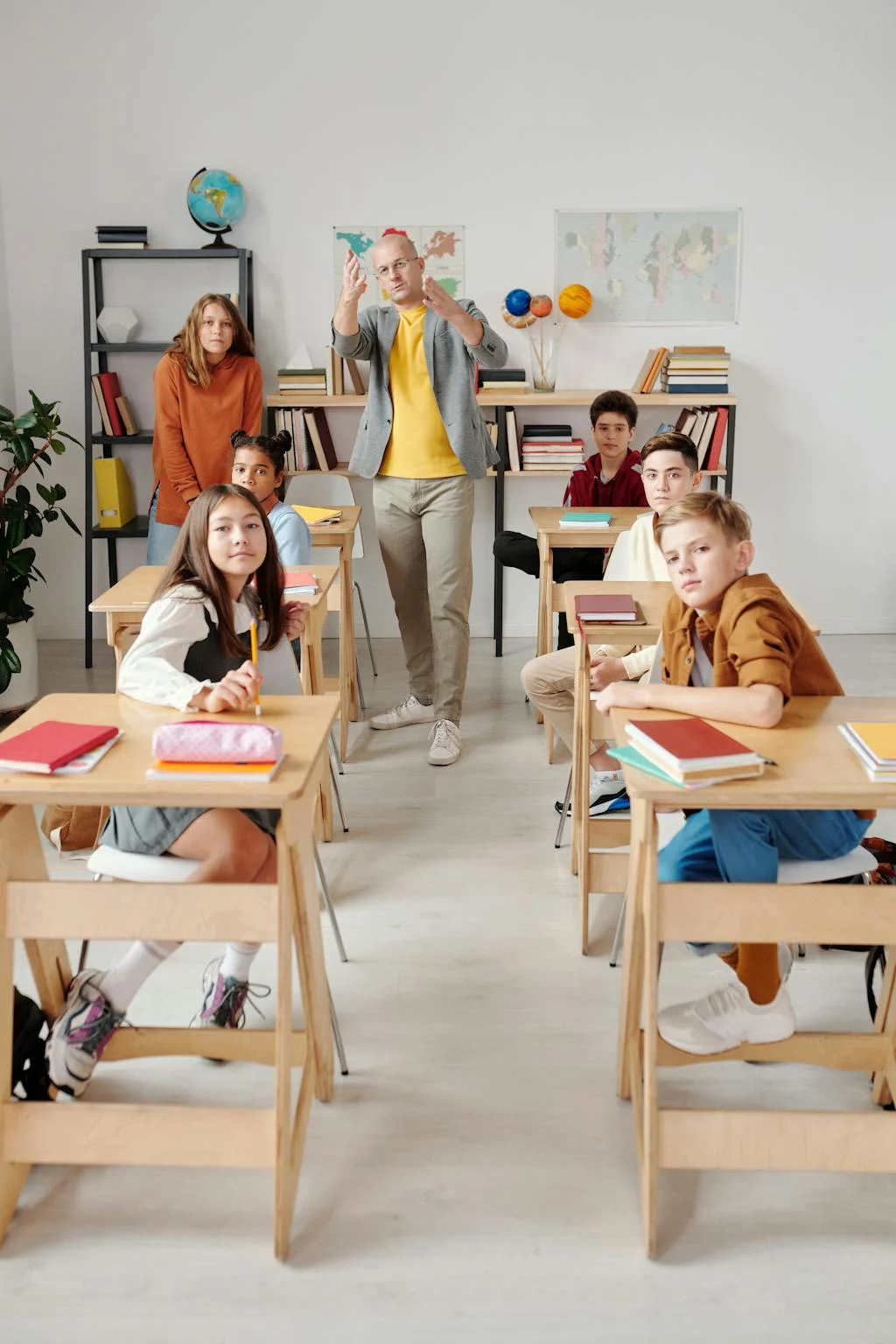 Diverse classroom of students with their teacher leading a Spread the Word: Inclusion discussion