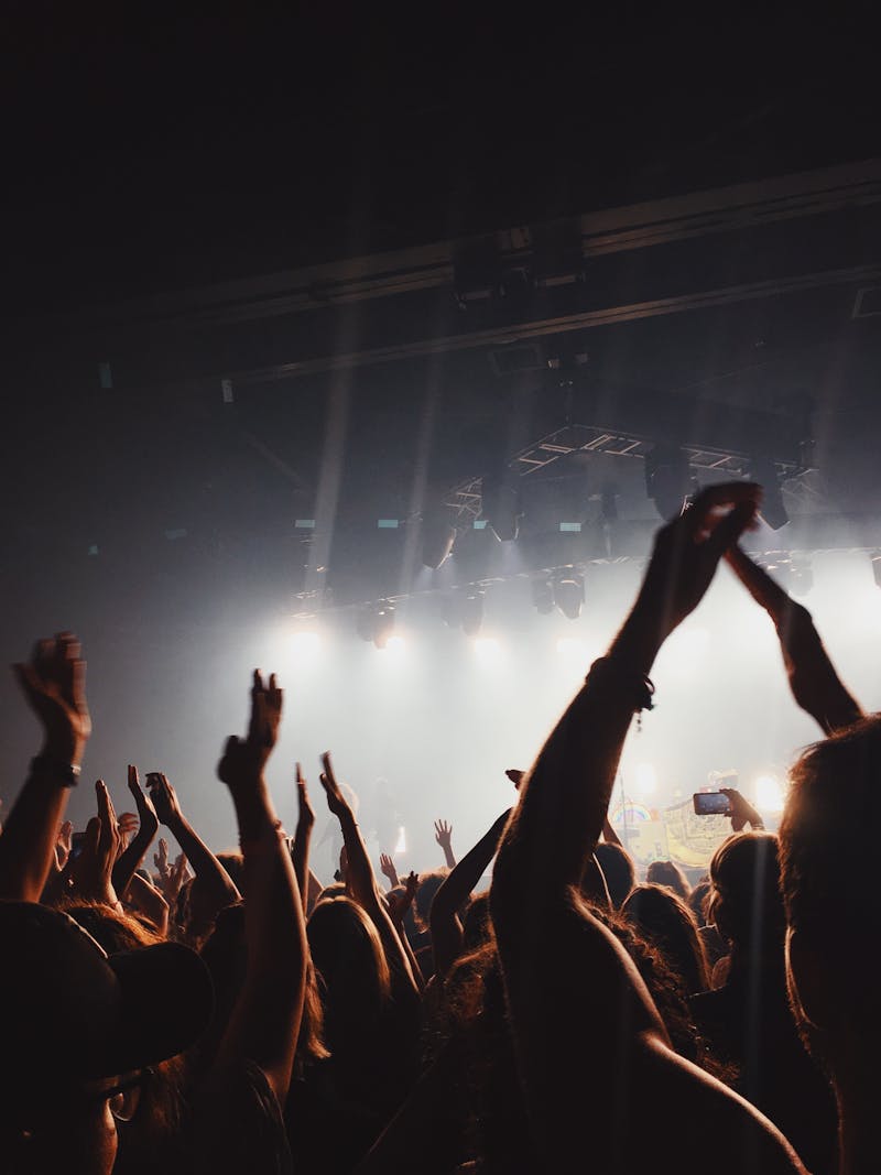 Large crowd at an organised event with access wristbands