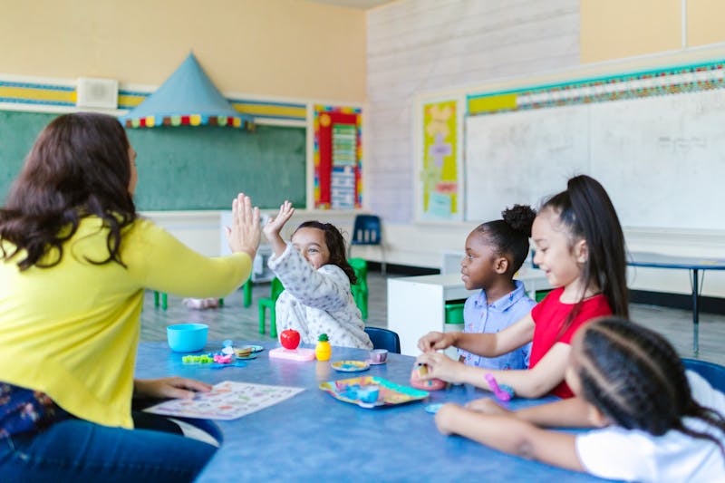 Children and teacher in a supportive classroom environment