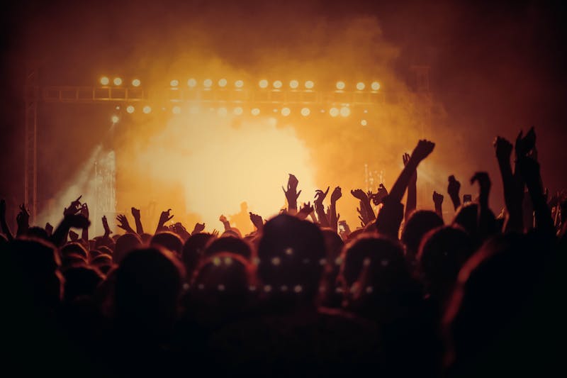 Outdoor summer festival with crowd enjoying live music