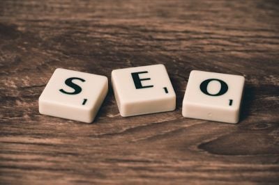 Small business owner doing SEO work on laptop